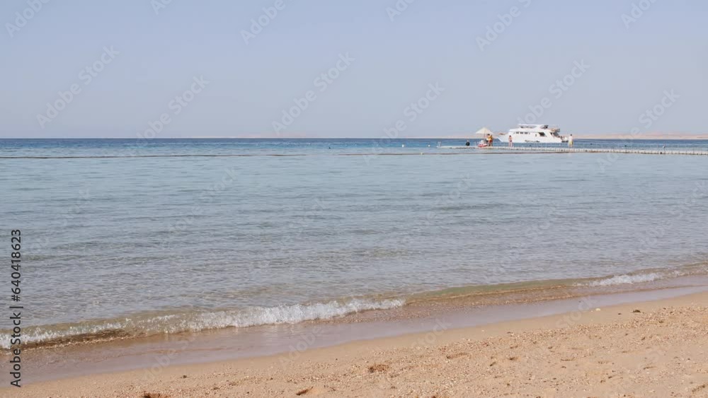 Sea water wave come to beach. Landscapes view of beach sea sand and sky in summer day. Beach sea space area on the tropical island. Advertising, background picture. Summer background. High quality 4k Sea water wave come to beach. Landscapes view of beach sea sand and sky in summer day. Beach sea space area on the tropical island. Advertising, background picture. Summer background. High quality 4k