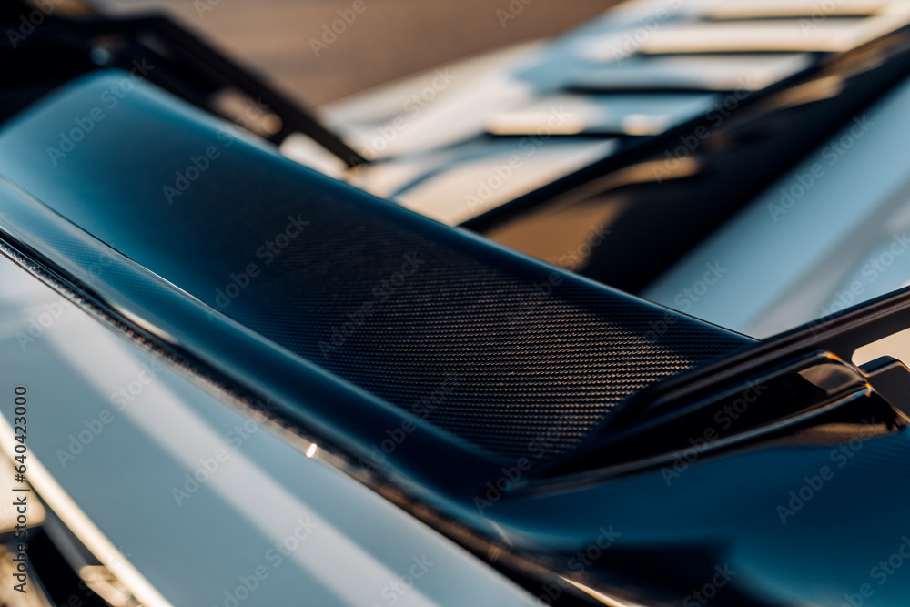 Carbon fiber rear wing on a car Carbon fiber rear wing on a car
