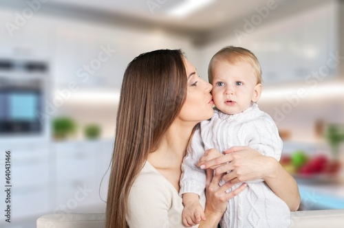 mother hold cute newborn baby at home