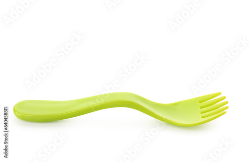 Green plastic fork for baby isolated on white background