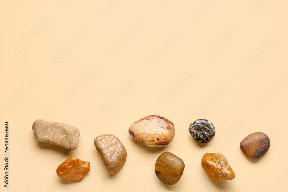 Many pebble stones on orange background Many pebble stones on orange background