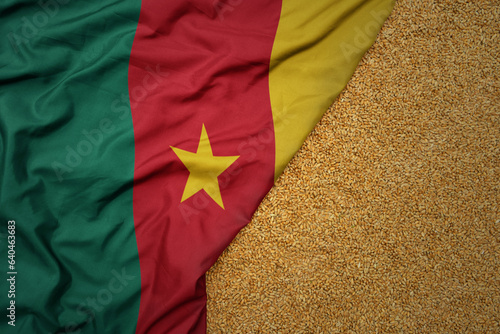 wheat grain on the waving colorful big national flag of cameroon .