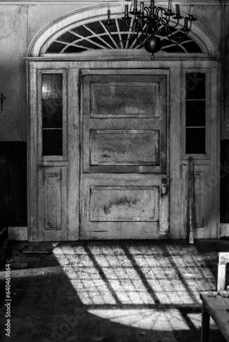 Creepy haunted antique door of plantation.