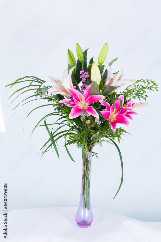 Many kinds of beautiful flowers put in vase on a white background Many kinds of beautiful flowers put in vase on a white background