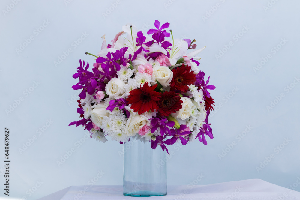 Many kinds of beautiful flowers put in vase on a white background Many kinds of beautiful flowers put in vase on a white background