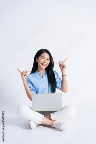 Photo of young Asian girl on white background