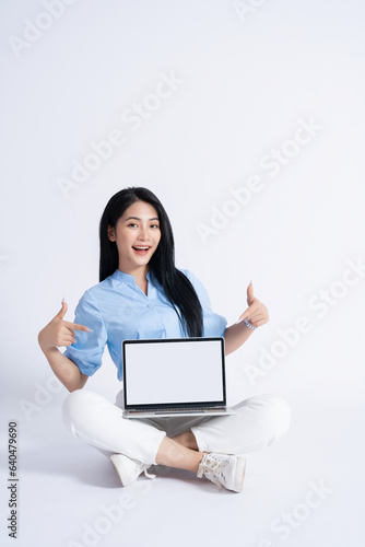 Photo of young Asian girl on white background