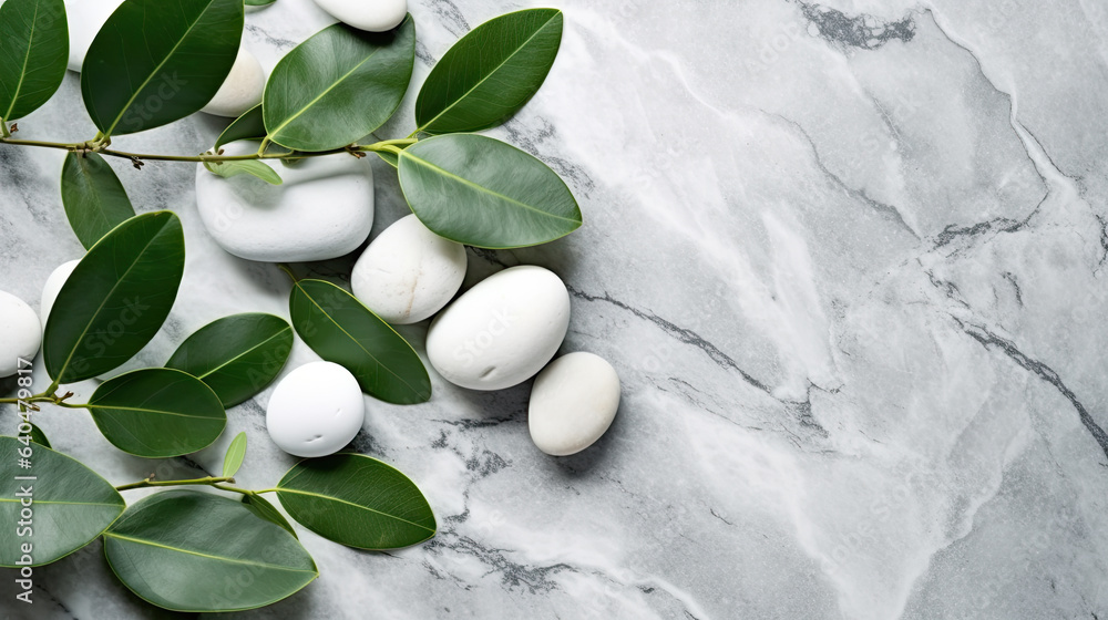 Spa stones and leaves on grey background Spa stones and leaves on grey background