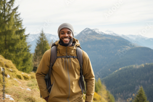 Happy black male hiking in nature. 
