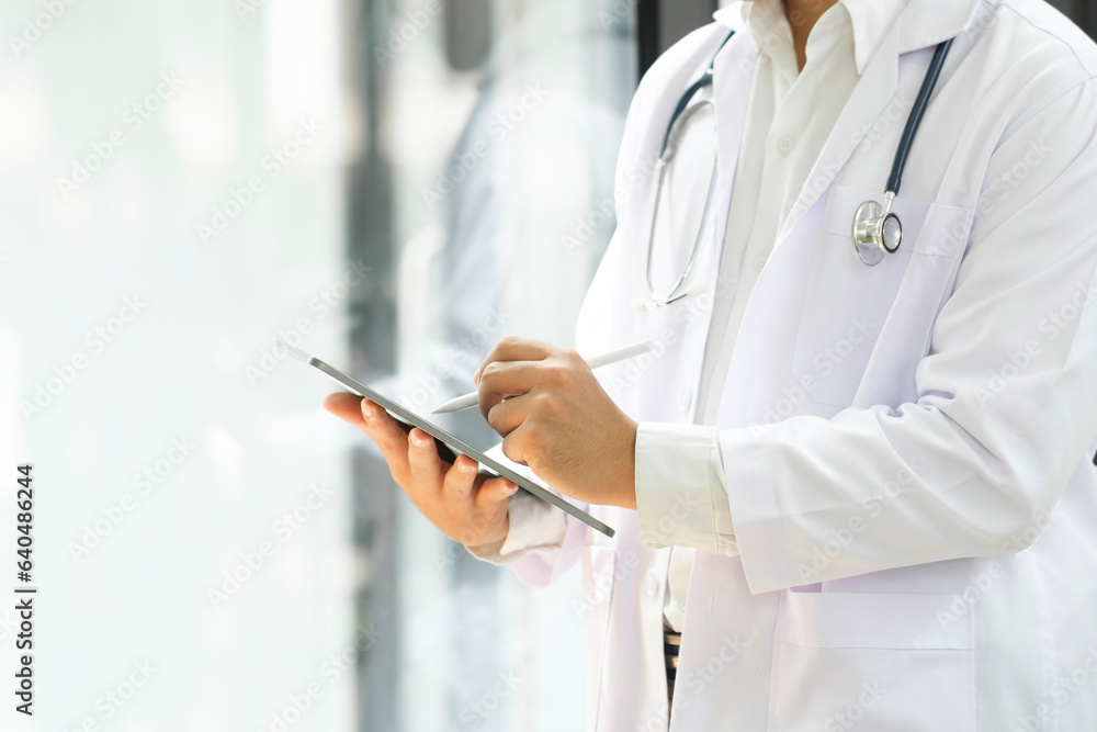 Close up of doctor hands using digital tablet at clinic. Close up of doctor hands using digital tablet at clinic.