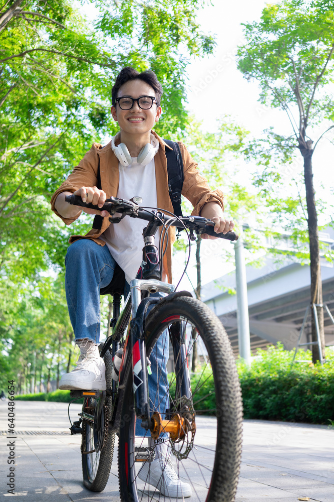 Portrait of young Asian man outside