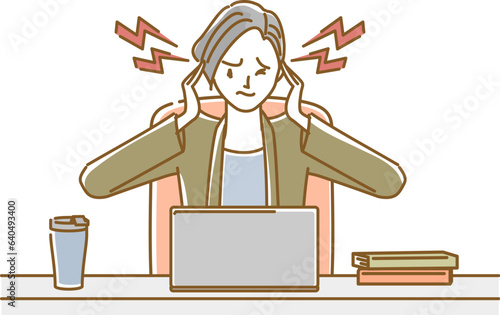 女性の体調不良（更年期障害）：仕事中に急な頭痛が起こり顔をしかめる.