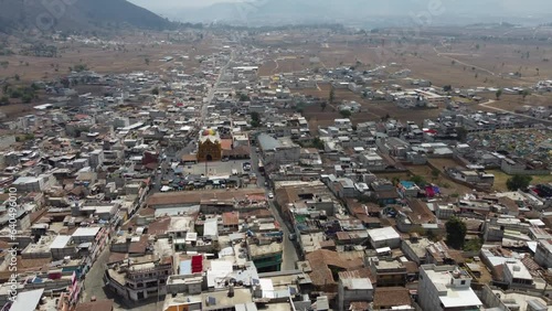 Aerial view of San Andres Xecul town in Guatemala, yellow Mayan church photo