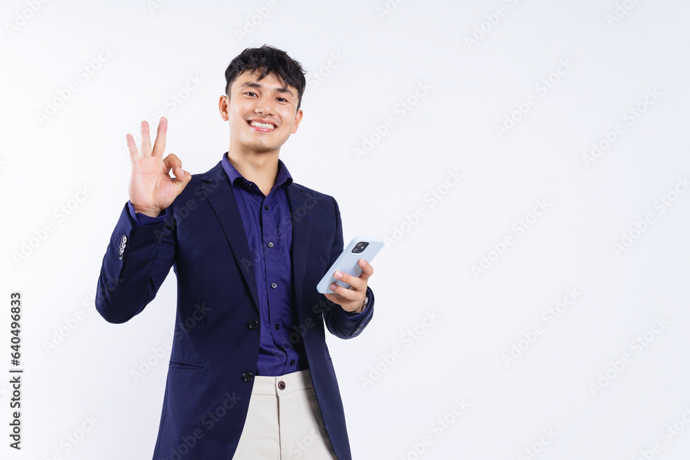 Photo of young Asian businessman on white background Photo of young Asian businessman on white background