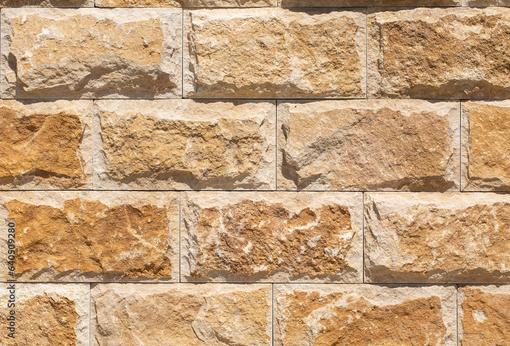 Fototapeta premium old red stone walll close up