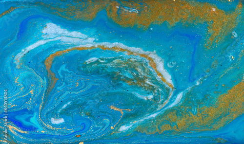Liquid Flow of Gold and Blue Paint Pattern