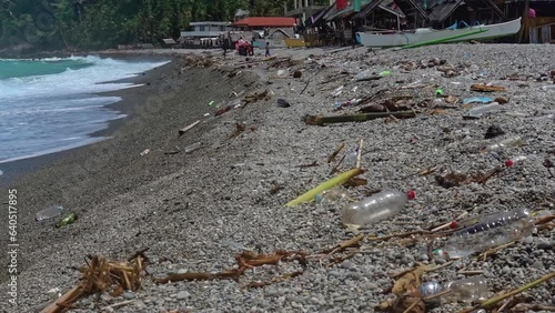 Looc beach, Surigao Del Norte, Philippines - 08-26-23. Hundreds of plastic bottles litter the beaches. A common site in many areas of the Philippines and a true environmental crisis. photo