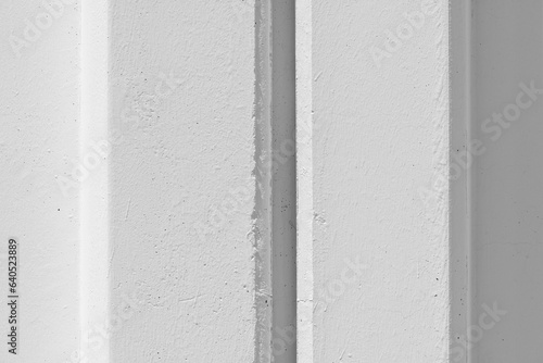 White concrete wall with reinforced post