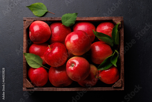 Wooden box with fresh red apples
