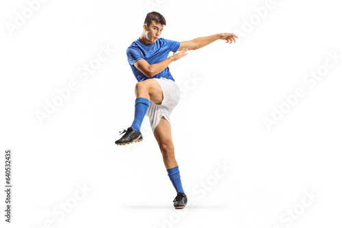 Young football player in a kicking pose © Ljupco Smokovski