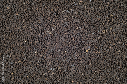 Ion-exchange Manganese green sand for water softening beads or granules texture background. Manganese green sand water filter for residential drinking or industrial texture surface,top view