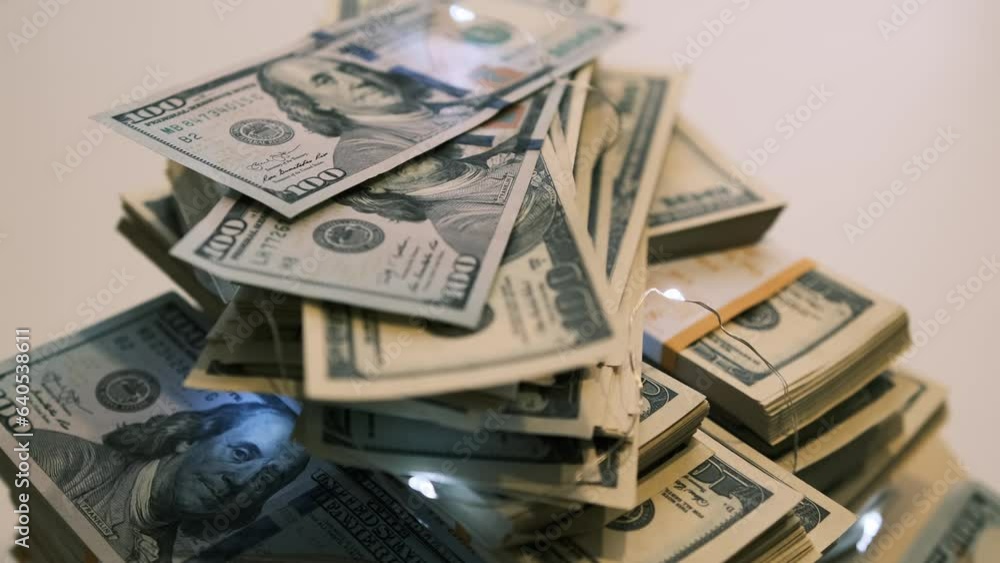 Close up pile of freshly printed 100 dollar bills American national currency united states rotating on white surface blurred background. Cash 100 dollar bills banknotes. Power and prosperity concept. Close up pile of freshly printed 100 dollar bills American national currency united states rotating on white surface blurred background. Cash 100 dollar bills banknotes. Power and prosperity concept.