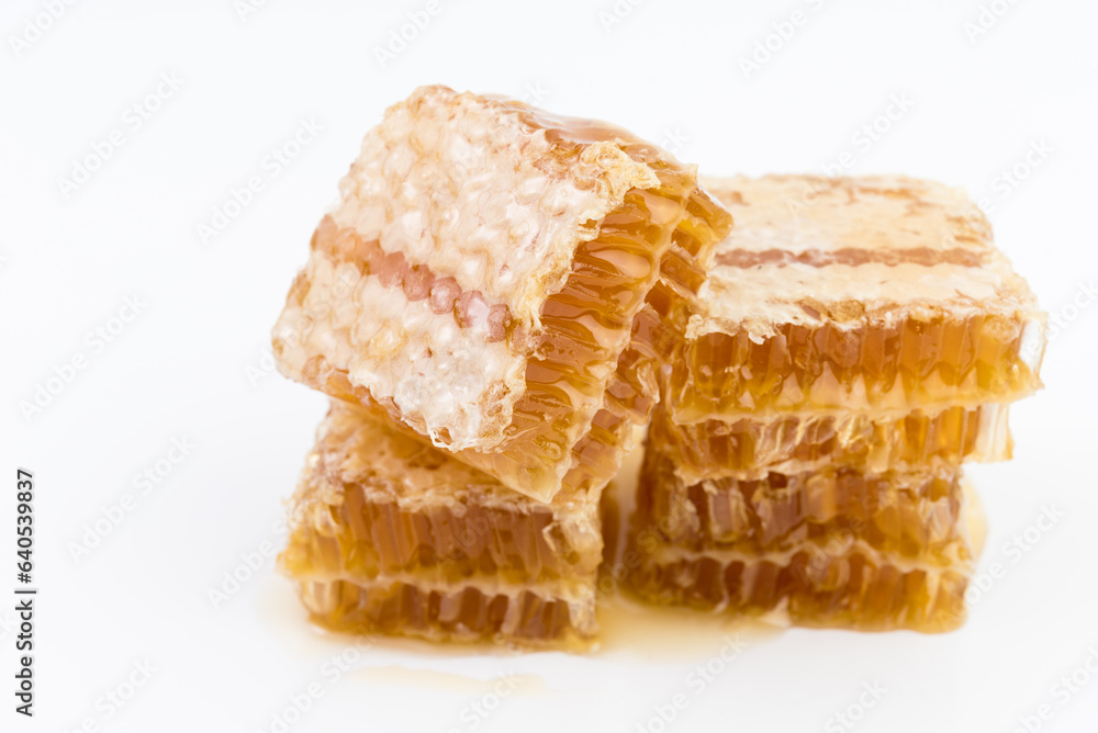 Honeycomb piece. Honey slice isolated on white background Honeycomb piece. Honey slice isolated on white background