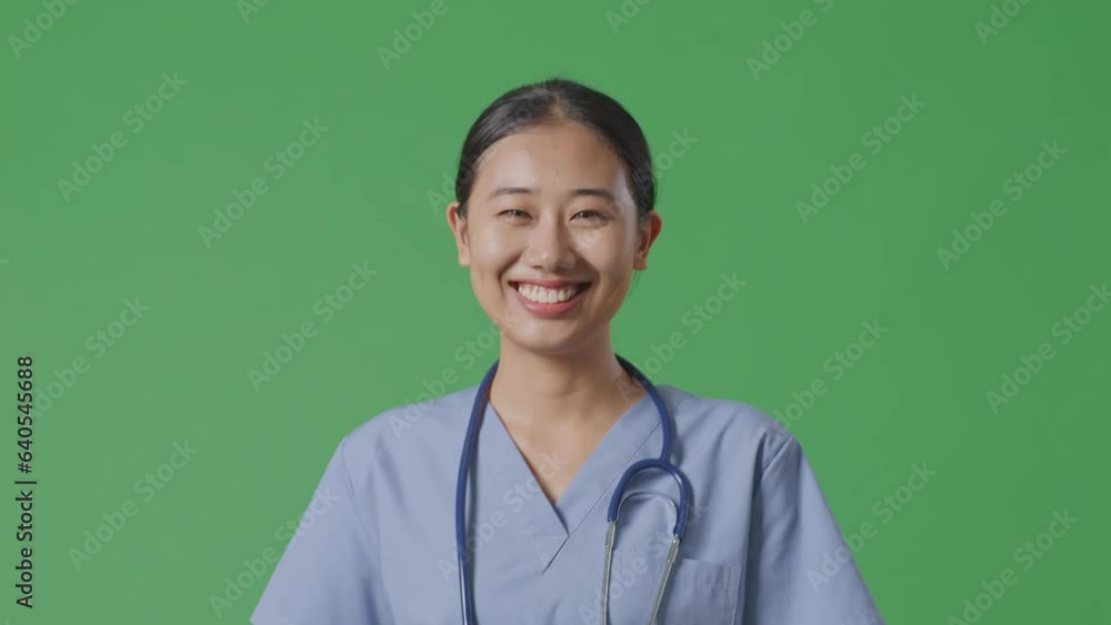 Close Up Of Asian Female Doctor With Stethoscope Walking On Green Screen Background In The Hospital
Close Up Of Asian Female Doctor With Stethoscope Walking On Green Screen Background In The Hospital