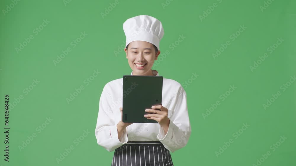Asian Woman Chef Using A Tablet While Walking In The Green Screen Background Studio
Asian Woman Chef Using A Tablet While Walking In The Green Screen Background Studio