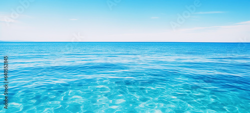 Tranquil sea water surface on coral  and sea fish tropical blue ocean underwater background