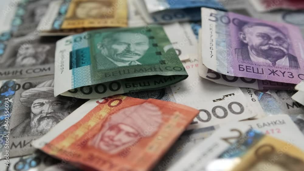 5000, 1000, 500, 200 and 50 som Kyrgyz Republic national paper currency business background, Kyrgyz som bills, different value banknotes tracking shot. Free currency exchange market. 5000, 1000, 500, 200 and 50 som Kyrgyz Republic national paper currency business background, Kyrgyz som bills, different value banknotes tracking shot. Free currency exchange market.