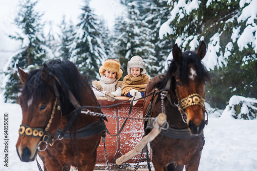 Fotografie Family outings on horseback and sleigh rides