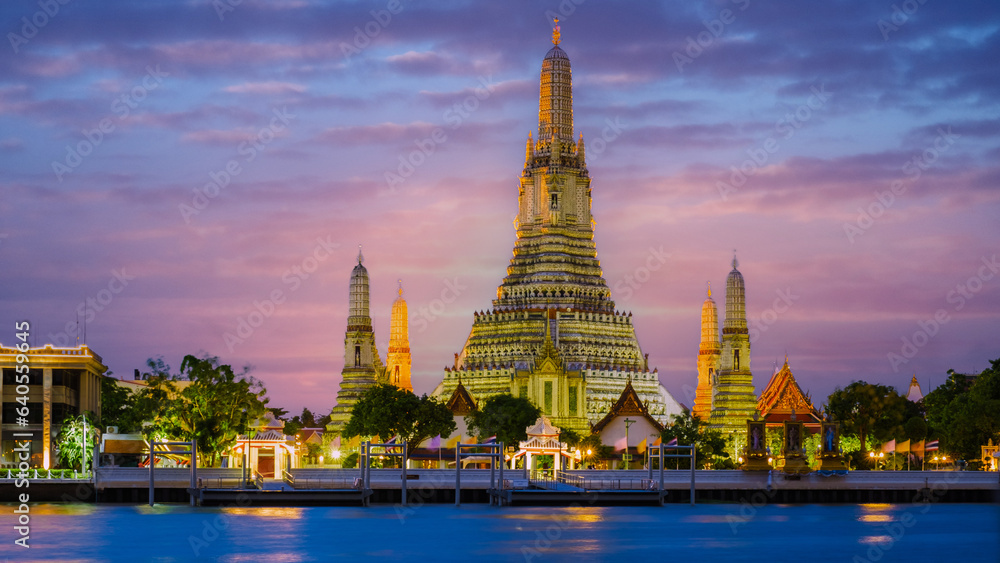 Wat Arun Temple Bangkok during sunset in Thailand. Chao Praya River at sunset at the riverfront