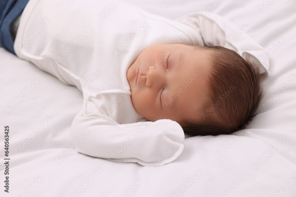 Cute newborn baby sleeping on white blanket Cute newborn baby sleeping on white blanket