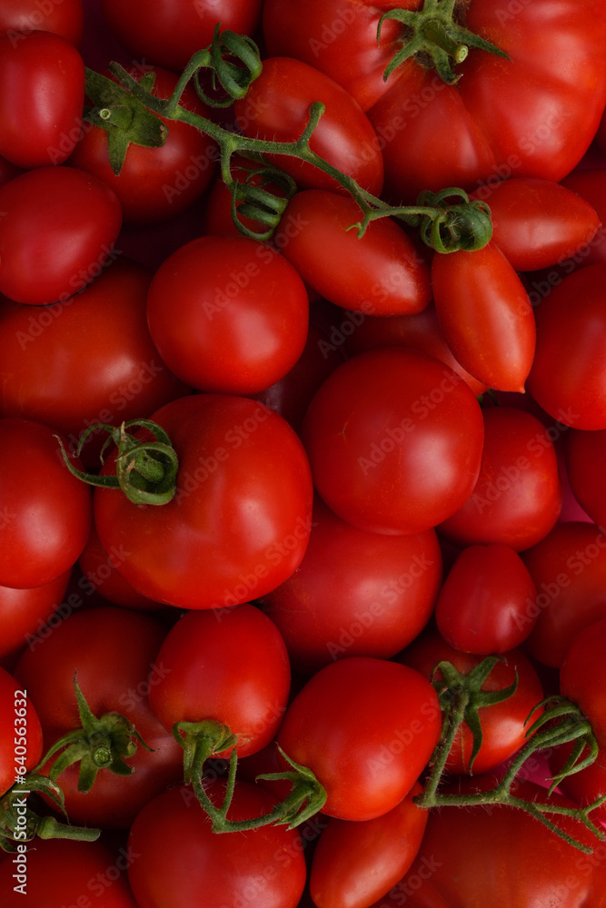 Tomatoes as healthy organic food background. Fresh vegetable at farmers market, diet and agriculture concept. Top view.