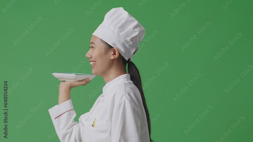 Side View Of Asian Woman Chef Holding A Dish While Walking In The Green Screen Background Studio
Side View Of Asian Woman Chef Holding A Dish While Walking In The Green Screen Background Studio