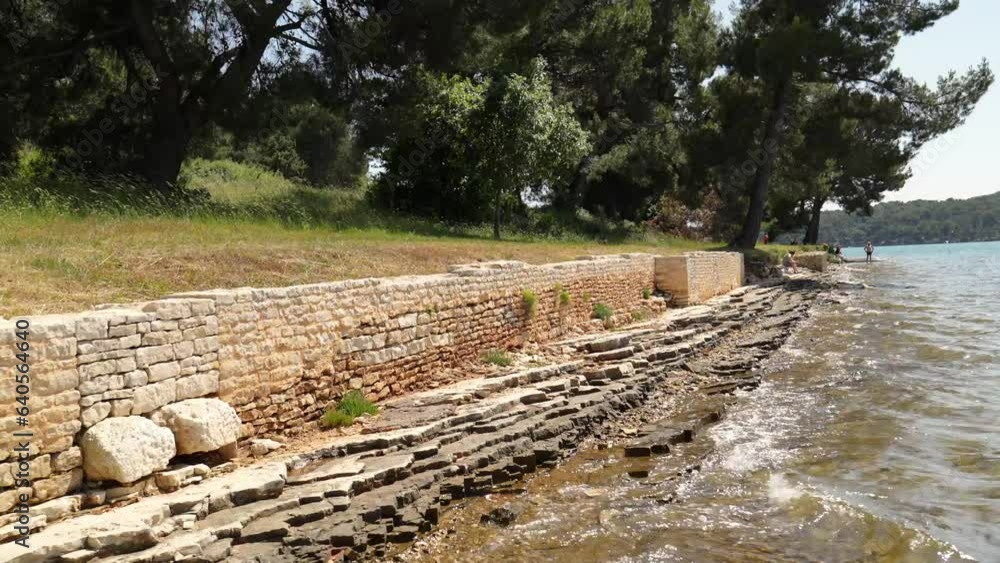 The remains of a Roman villa are being eroded by sea water. Coastal erosion The remains of a Roman villa are being eroded by sea water. Coastal erosion