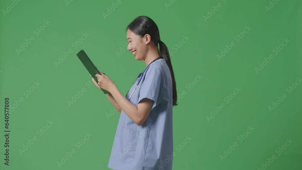 Side View Of Asian Female Doctor With Stethoscope Using A Tablet While Walking On Green Screen Background In The Hospital
Side View Of Asian Female Doctor With Stethoscope Using A Tablet While Walking On Green Screen Background In The Hospital