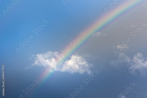 Beautiful rainbow and Blue sky with cloud in summer day.