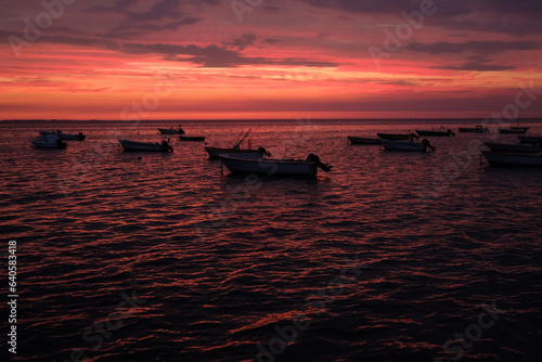 Fishing boats in the red Sunset light
