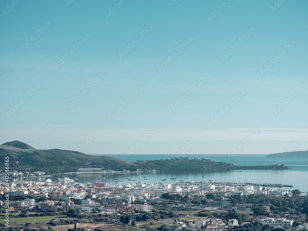 Town and hills on coast of sea