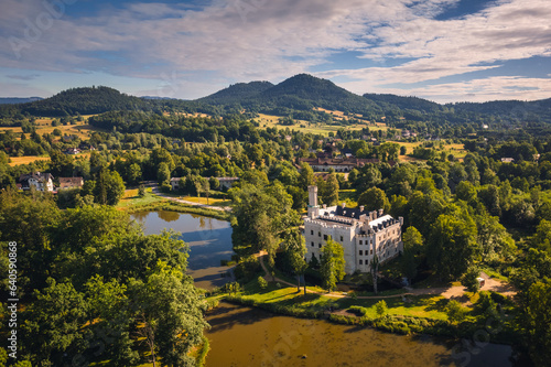 Aerial view of Karpniki Palace and Giant Mountains in Lower Silesia- captured in summer day. This place is local atraction. © PawelUchorczak