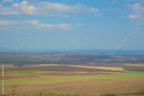 Panoramic view of the endless horizon of fields on a clear sunny day