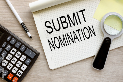 Wallpaper Mural SUBMIT NOMINATION magnifying glass on the page. open notebook with text. wooden background. Torontodigital.ca