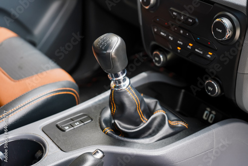 automatic transmission shift selector in the car interior. Closeup a manual shift of modern car gear shifter. 4x4 gear shift