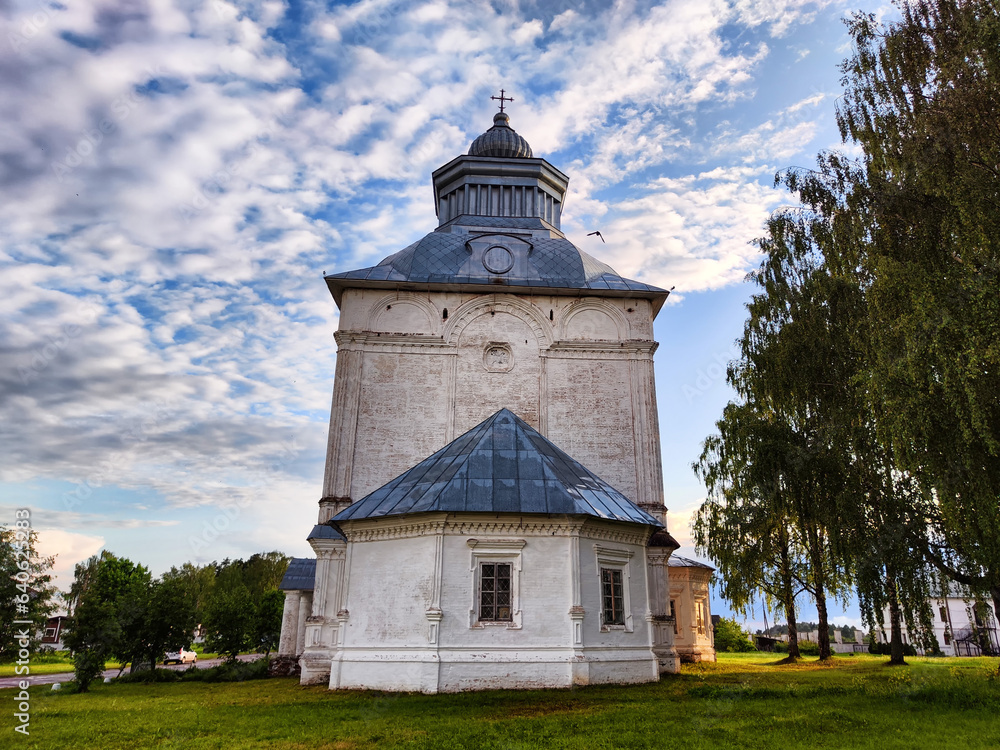Orthodox church with a dome against the backdrop of a spring or summer sky with clouds. Beautiful old historic temple