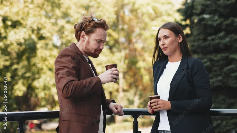 Businessmen man and woman are talking on a summer terrace and discussing a new project. The concept of business processes outdoors.
Businessmen man and woman are talking on a summer terrace and discussing a new project. The concept of business processes outdoors.