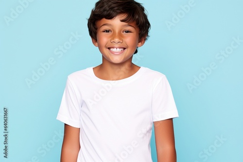 young boy wearing white tshirt for mock up on neutral background