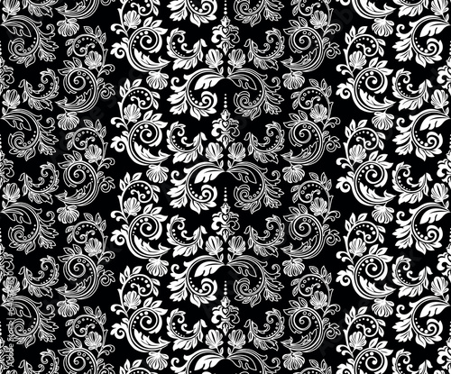 Wallpaper in the style of Baroque. Seamless vector background. White and black floral ornament. Graphic pattern for fabric, wallpaper, packaging. Ornate Damask flower ornament