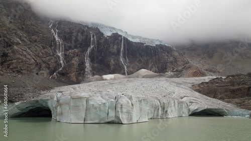 Europe, Italy, Sondrio Valmalenco Alpe Gera- drone view of Fellaria glacier in Alps - rapid melting of ice iceberg causes sea level rise. Global warming and climate change cause drought and aridity 